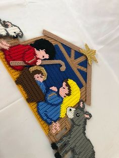 the nativity scene is made out of plastic beads