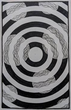 a black and white drawing with circles in the middle, on a piece of paper