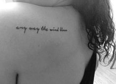 the back of a woman's shoulder with an inscription that says, every way the wind will blow