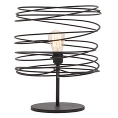 a light that is on top of a metal stand with spirals and lightshades