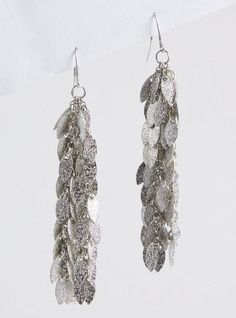 FIT Measures 3. 45” long. . MATERIALS + CARE Base metal. . Imported. DETAILS Feather fringe drop. High shine finish. . The best plus size women's fringe feather linear earrings in silver. Torrid is your destination for the freshest spring and summer styles. Linear Earrings, Feather Fringe, Fitted Wedding Dress, Sparkle Earrings, Summer Styles, Bra Cups, Bohemian Jewelry, Lower Case Letters, Base Metal