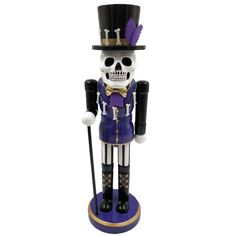 a skeleton figurine wearing a top hat and holding a cane in front of a white background