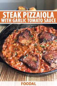 steak pizza with garlic tomato sauce in a cast iron skillet