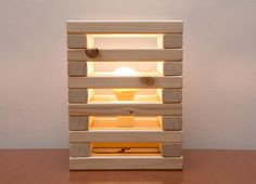 a wooden shelf with lights on top of it