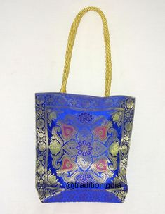 "Indian Handmade Banarasi Brocade shoulder Bag. Made with soft Banarasi Brocade. It has zip closure on the top so it is safe to carry around your mobile,tablet and other belongings and also a small zip closure compartment so you can put your money in it. Available in multiple colors which can be matched with your outfit. Check our shop for more colors and varieties. Bag size- 12\" x 12\" Color - Blue --------------------------------------------------------------------- Postage & Shipping - Order Silk Bag, Girly Bags, Handmade Purses, Wedding Bag, Womens Purses, Handbag Backpack, Clutch Handbag, Evening Bags, Bags Handbags