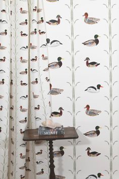 the wall paper has ducks on it