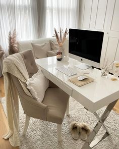 a white desk with a computer on it