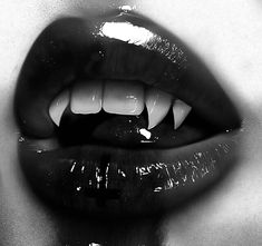 a black and white photo of a woman's mouth