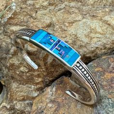 David Rosales Stardust Inlaid Sterling Silver Bracelet Sterling Silver Southwestern Bracelet, Southwestern Sterling Silver Bracelet With Turquoise Inlay, Contemporary Southwest, Southwestern Style Hand-strung Blue Bracelets, Black Arrow, Nickel-free Southwestern Sterling Silver Bracelet, Southwestern Style Blue Nickel-free Cuff Bracelet, Black Jade, American Indian Jewelry