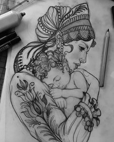 a drawing of a woman holding a baby on top of a table next to a pen