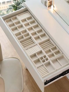 a white desk with drawers sitting on top of it