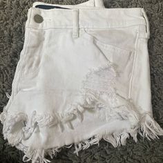 Super Cute Frayed White Jean Shorts, Perfect For Summer. Never Worn White Stretch Mid-rise Jean Shorts, Stretch Mid-rise White Jean Shorts, Trendy White Short Pants, White Stretch Cutoff Jean Shorts, White Stretch Mid-rise Shorts, White Short Pants For Day Out, White Cutoff Bottoms For The Beach, White Cutoff Bottoms For Beach, White Cutoff Summer Bottoms