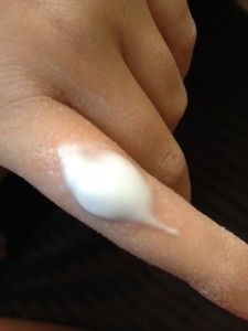 a person's hand with white powder on it