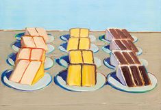 three plates with different types of desserts on them, one is blue and the other is yellow