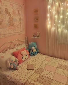 a bedroom with pink walls and teddy bears on the bed