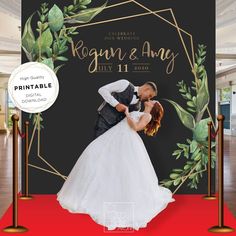 an image of a newly married couple kissing on the red carpet in front of a black backdrop