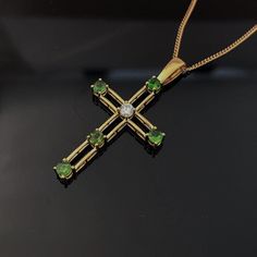 Green Emerald Cross necklace, Solid Gold Cross Necklace - Diamond Necklace, Emerald Pendant - May Birthstone, anniversary gift Solid gold emerald pendant, set with one center Moissanite Diamond in a contemporary design. Emerald is the birthstone for May. Unique design Morden gold Cross pendant by Chenny from our studio in Jersey CI. Available with other gemstones, please contact me for your gemstone choice. Emerald, the birthstone of May, carries the rich green colour of Spring and radiates a be Luxury Emerald Square Pendant Necklace For Gift, Yellow Gold Emerald Necklace With Square Pendant For Gift, Luxury Gold Emerald Necklace With Square Pendant, Green Emerald Square Pendant Necklace, Emerald Cross Pendant, Emerald Cross, 40th Wedding Anniversary Gifts, 55th Wedding Anniversary, Necklace Emerald