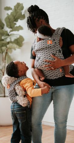 a woman holding a baby in her arms