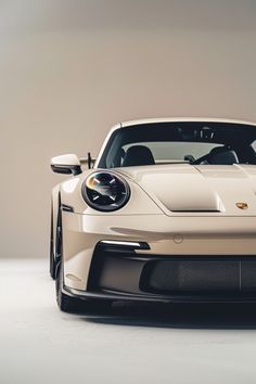 the front end of a white sports car