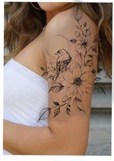 a woman's arm with flowers on it