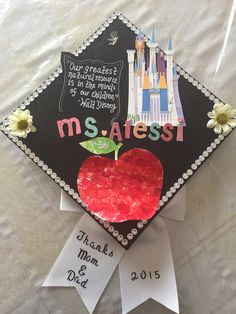 a graduation cap decorated with an apple and the words ms atessi on it