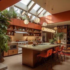 a kitchen with an island and orange chairs