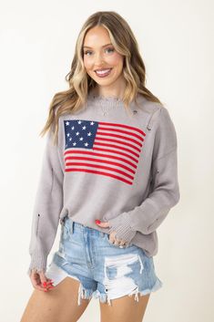 The perfect sweater for any summer holiday is this Miracle American Flag Distressed Sweater for Women in Grey! Featuring a midweight cable knit construction, oversized fit, and American flag graphic. Great for July 4th or memorial day! Miracle Clothing Style: L2402-SILVER Color: Grey 60% Cotton 40% Acrylic Women’s sweaters American flag graphic on front Cable knit fabric Distressed cuts Oversized fit Measurements from a size XS/S: Length from center back: 19" Chest: 23" Fall Flag Print Long Sleeve Sweater, Long Sleeve Flag Print Sweater For Fall, Fall Long Sleeve Flag Print Sweater, Long Sleeve Americana Sweater For Fall, Americana Long Sleeve Sweater For Fall, Fall Americana Long Sleeve Sweater, Casual American Flag Sweater For 4th Of July, Fall Flag Print Crew Neck Sweater, Casual Long Sleeve Sweater For 4th Of July