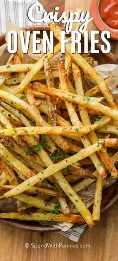 crispy oven fries on a plate with ketchup