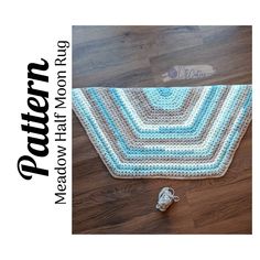 a crocheted rug is on the floor next to a pair of shoes