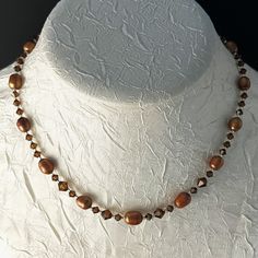 New Handmade Necklace Is Made Of Copper Brown Rice Pearls, Swarovski Smoky Topaz Crystals In Graduated Sizes, Silver-Lined Delica Seed Beads, A Silver-Plated Hook And Eye Clasp With An Extender. This Necklace Measures 16" Long And Has A 2-1/2" Extender. It Is Very Vintage Boho. * This Is A One-Of-A-Kind Necklace. * There May Be Some Color Discrepancies Due To Different Monitor Settings. The Colors Are Described As Clearly And Genuinely As Possible. * All Items Are Created In A Smoke-Free And Pet Crystal Necklace With Spacer Beads For Gift, Crystal Necklaces With Spacer Beads For Gifts, Elegant Brown Crystal Necklace With Adjustable Fit, Elegant Adjustable Brown Crystal Necklaces, Elegant Brown Crystal Necklace, Elegant Crystal Necklace With Spacer Beads As Gift, Crystal Necklaces With Round Beads For Anniversary, Anniversary Crystal Necklaces With Round Beads, Anniversary Necklace With Crystal Round Beads