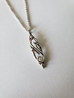 Sterling silver asymmetric swirl filigree style pendant. Measures 1 1/2 x 1/2 inches. An 18 inch chain is included. Designed and handcrafted by Richelle Leigh using the lost wax casting process. Free shipping US. Matching ring here: https://www.etsy.com/listing/478789629/sterling-silver-swirl-long-finger?ref=shop_home_active_274&frs=1 Matching bracelet here: https://www.etsy.com/listing/262034207/chunky-wide-sterling-silver-swirl-link?ref=shop_home_active_1&frs=1 Entire shop: https://www.etsy.co Nickel-free Sterling Silver Swirl Necklace, Sterling Silver Swirl Necklaces, Silver Swirl Necklace For Gifting, Silver Swirl Necklace Perfect For Gifts, Silver Swirl Necklace For Gift, Spiral Jewelry With Intricate Design For Gift, Harrisburg Pa, Gothic Accessories, Matching Ring