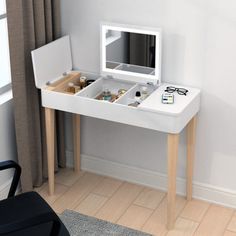 a white desk with drawers and a mirror on it