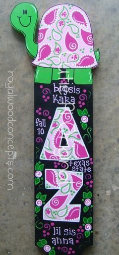 a skateboard shaped like a turtle with the number four on it's back