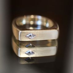 4mm x 2.5mm white kite diamond Solid 14k yellow gold Brushed finish with high shine details Band measures 3.5mm, tapers to 4.5mm face Size 5.5, sizable OOAK Made by Good Fortune in Long Beach, CA *This ring can be resized, please confirm your final ring size before purchasing. If you would like this ring resized, please make a note of the size you need in the “Special Instructions” section of your cart. Adjustments are an additional 2-3 weeks and all sales are final on sized jewelry.* Modern Princess Cut Single Diamond Jewelry, Modern 14k Gold Diamond Cut Ring, Modern 14k Gold Diamond Ring With Diamond Cut, Modern Gold Marquise Cut Jewelry, Modern Marquise Cut Gold Jewelry, Modern Rectangular Diamond Cut Ring, Modern Gold Wedding Rings With Single Cut Diamonds, Gold Rectangular Ring With Single Diamond, Modern Jewelry With Marquise Diamond Cut