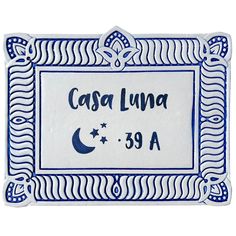 a blue and white ceramic plaque with the name casa luna on it's side