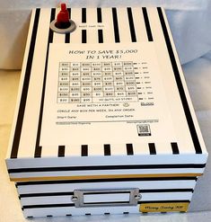 a white box with black and gold stripes on it that says how to save $ 3, 000 in 1 year