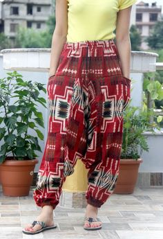 This Aztec Woolen Yoga Trouser or pant is warm and cozy, made from high-quality Acrylic Fibre. It is perfect for Winter. It has a comfortable elastic waist, and one size fits most. It is perfect for Holidays, Nightwear, Cool Winter Days, and Travel. Features: Spacious Loose-fitting Versatile Super comfortable Durable Easy to wear Place of Origin: Nepal MOQ: 10 pcs Note: For bulk order, we can customize the size and manufacture it in bulk with your own brand. Contact us. Casual Winter Yoga Pants, Casual Harem Yoga Pants, Bohemian Red Pants For Loungewear, Casual Red Harem Pants For Festival, Bohemian Red Loungewear Bottoms, Comfortable Red Cotton Pants, Casual Harem Yoga Pants With Pockets, Red Casual Harem Pants For Loungewear, Casual Red Harem Pants For Loungewear