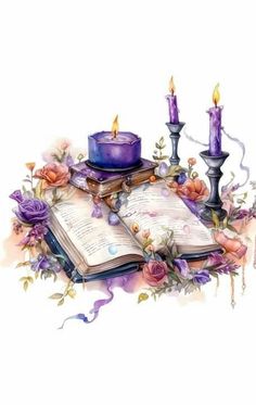 an open book with candles and flowers around it