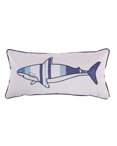 a blue and white pillow with a shark on it's side, in the shape of a fish