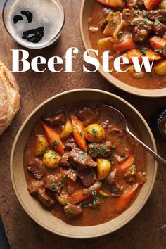 two bowls of beef stew with potatoes and carrots