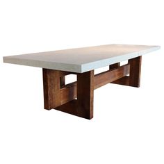 a white table sitting on top of a wooden floor