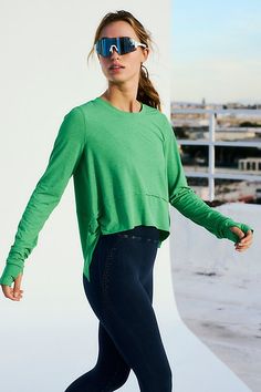 The perfect layer for all your workouts, this long-sleeve tee features a flowy, A-line silhouette with raw seam details and thumbholes at the sleeves. * Crewneck style * Lightweight design * Curved hemline | Tempo Long-Sleeve T-Shirt by FP Movement at Free People, Green Sheen, XS Long Sleeve Moisture-wicking Activewear, Long Sleeve Moisture-wicking Activewear For Layering, Versatile Green Long Sleeve Activewear, Green Functional Tops With Thumbholes, Functional Green Long Sleeve Tops, Sporty Long Sleeve Activewear For Layering, Spring Crew Neck Long Sleeve Top For Workout, Spring Activewear With Thumbholes And Long Sleeves, Green Long Sleeve Athleisure Top