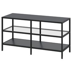 a black shelf with glass shelves on each side