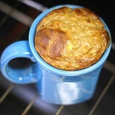 a muffin in a blue cup on a rack