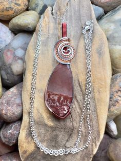 Apache sage rhyolite with titanium, antique copper, and burgundy wire wrap Comes with  18" sterling silver plated chain shown in photos.  Pendant measures  2-1/8"  x  11/16" Hand Wrapped Jasper Pendant Necklace, Hand-wrapped Jasper Pendant Necklace, Wire Wrapped Jasper Pendant Necklace, Brown Jasper Wire Wrapped Necklace, Apache Jewelry, Wire Wrap, Antique Copper, Pendant Necklaces, Jewelry Inspiration