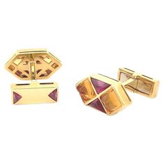 Step into the realm of elegance and sophistication with these captivating "Russian Candy" cufflinks, crafted from lustrous 18k yellow gold and adorned with exquisite sugarloaf citrine and triangle garnets in a mesmerizing geometric design. Inspired by the vibrant hues and geometric patterns of traditional Russian candies, these cufflinks are a celebration of artistry and luxury. The geometric motif, intricately crafted in radiant 18k yellow gold, exudes a sense of modernity and refinement. The meticulous craftsmanship and attention to detail are evident in every facet of these cufflinks, from the precise arrangement of the gemstones to the polished finish of the gold setting. The smooth contours and clean lines of the geometric shapes create a striking visual impact, making these cufflinks Luxury Designer Yellow Gold Cufflinks, Russian Candy, Geometric Design, Geometric Shapes, Citrine, Statement Pieces, Garnet, Cufflinks, Geometric Pattern