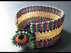 colorful beaded bracelets with an evil eye on them