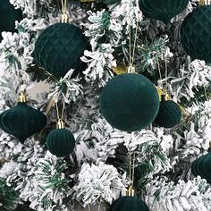 a christmas tree decorated with green and white ornaments