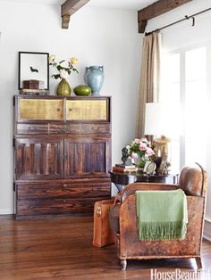 a living room filled with furniture and wooden floors