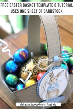 an easter basket filled with chocolate eggs on top of a wooden table